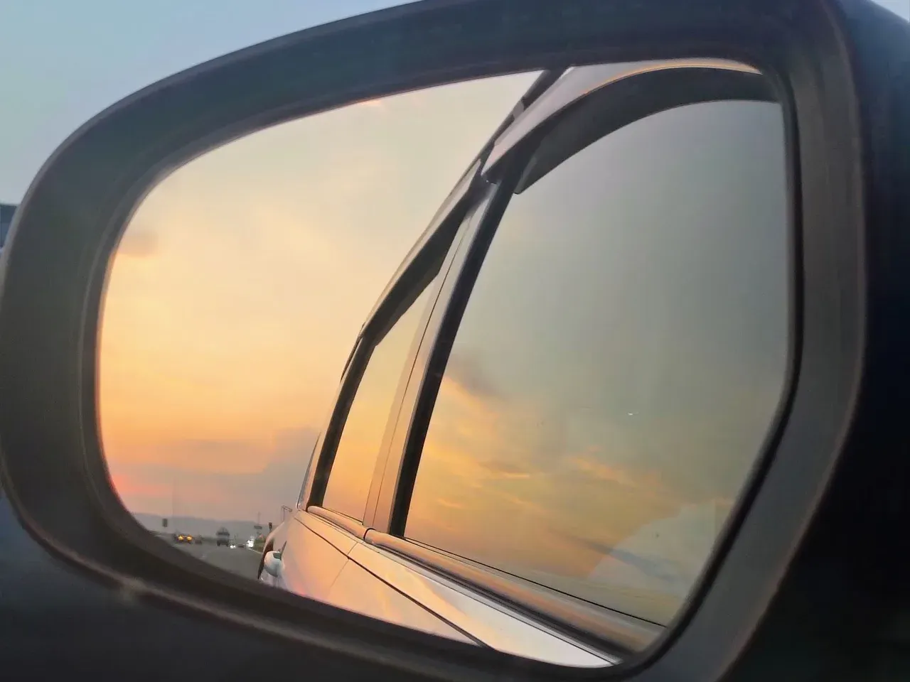 Sunset in a car side mirror